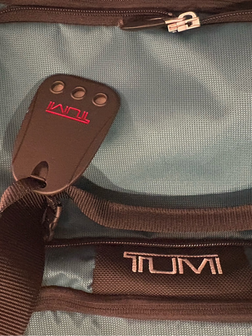 Tumi Teal Travel Duffel / backpack 
Very roomy to store things in very sturdy - Picture 4 of 13